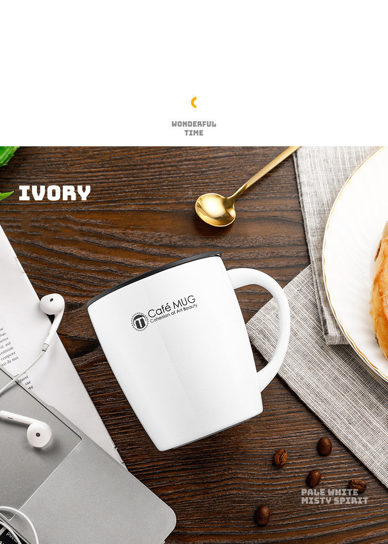 White mug with 'Cafe Mug' branding on a wooden table with coffee beans and a spoon.
