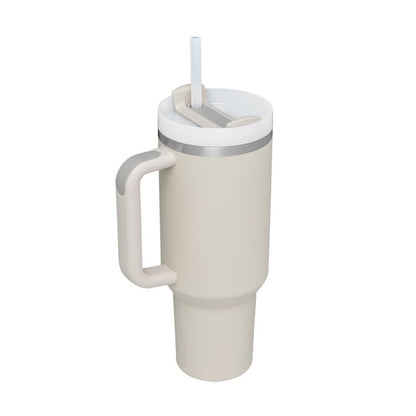 Beige tumbler with handle and straw lid on a white background