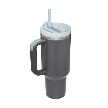 Gray travel mug with handle and straw lid on a white background