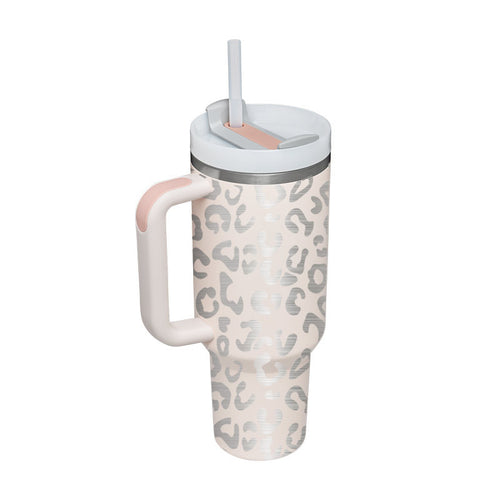 Leopard print tumbler with pink handle and straw on a white background