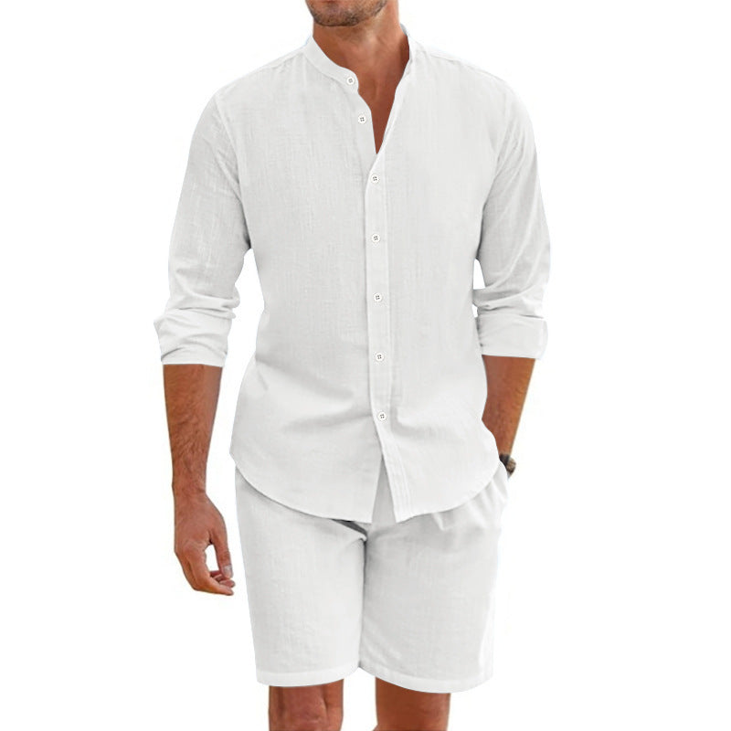 Man wearing a white long-sleeve shirt and shorts on a white background
